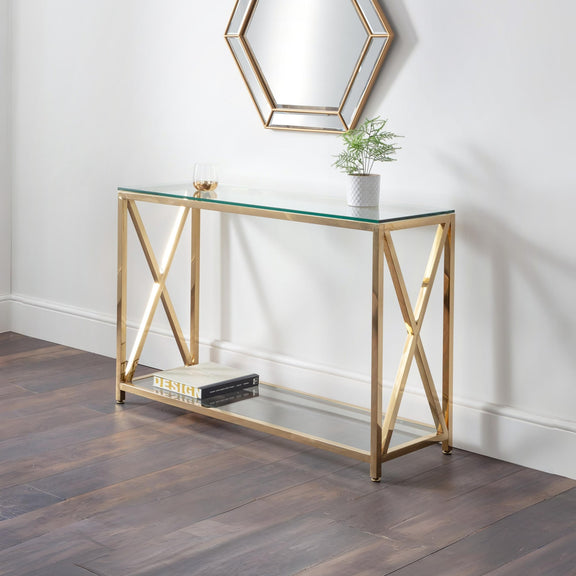 Gold console table with glass top in a room setting
