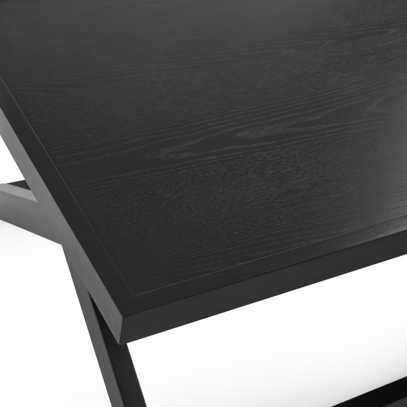 Close-up of a black wooden table with a white background