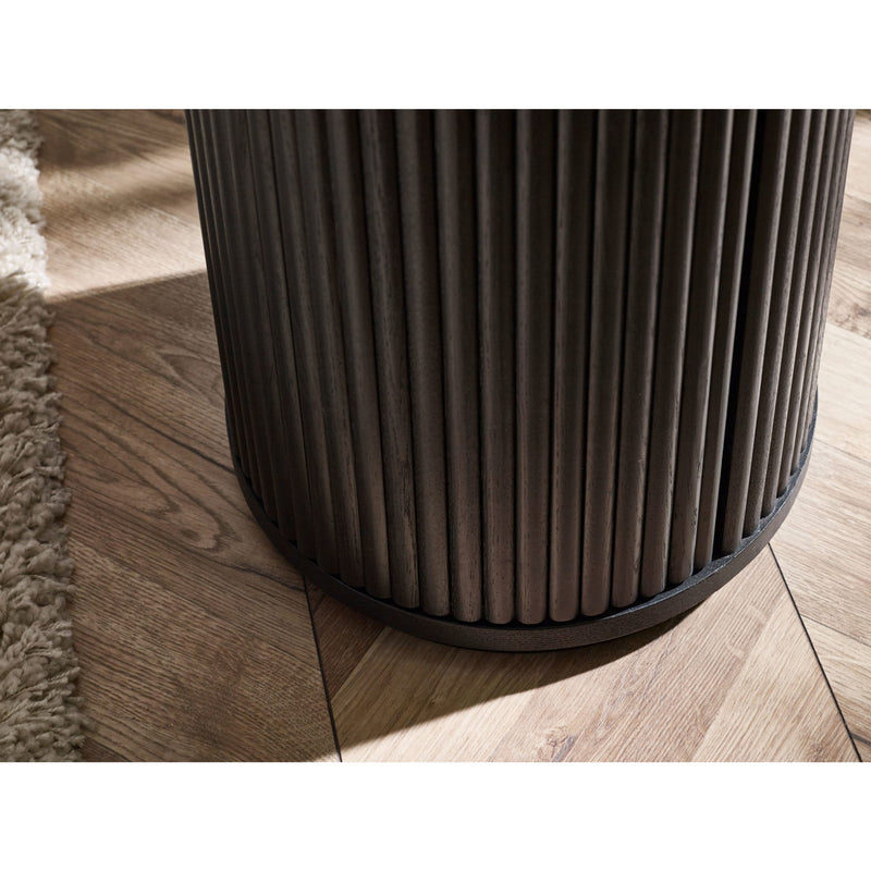 Dark brown cylindrical trash can on a wooden floor