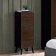 Wooden dresser with four drawers against a gray wall in a room setting.