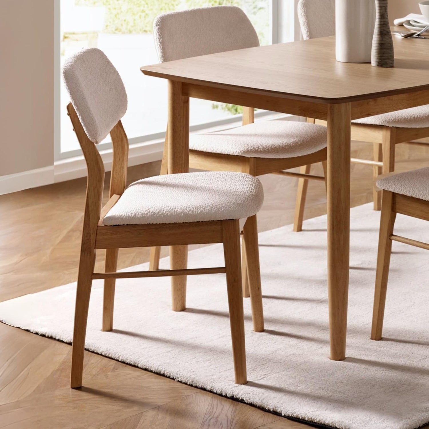 Dining room with wooden table and chairs on a rug