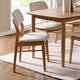 Dining room with wooden table and chairs on a rug