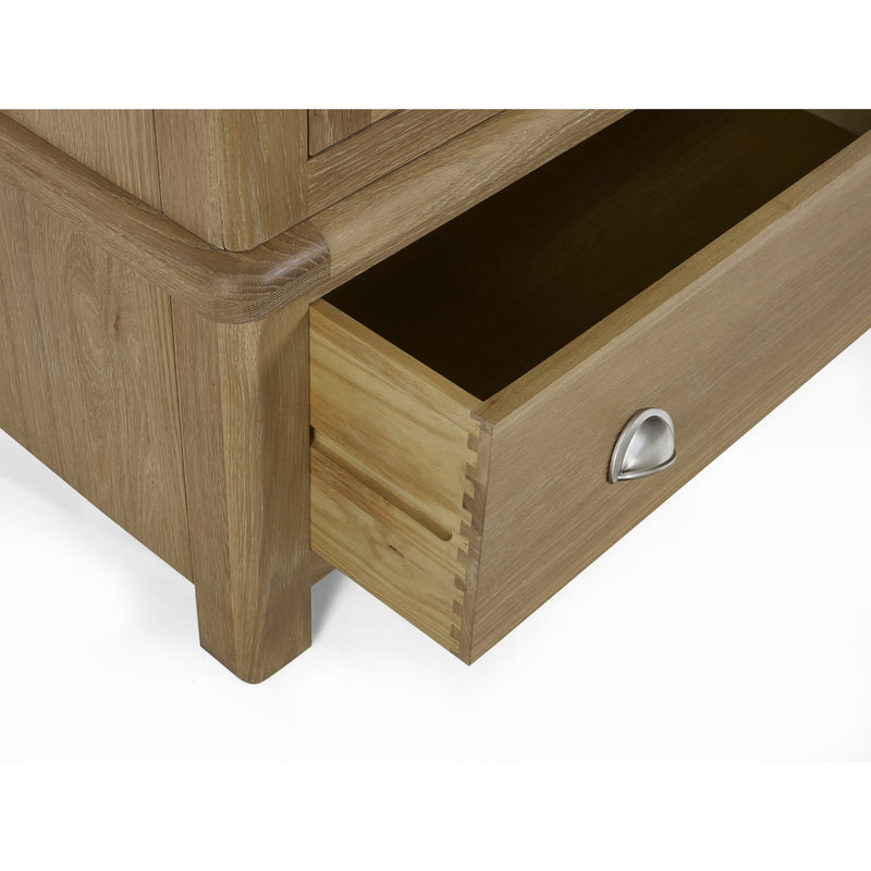 Wooden drawer with a metal handle on a white background