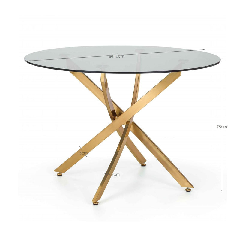 Round glass table with gold metal legs on a white background