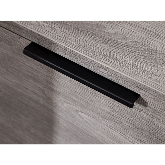 Black handle on a wooden drawer