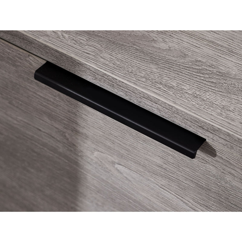 Black handle on a wooden drawer