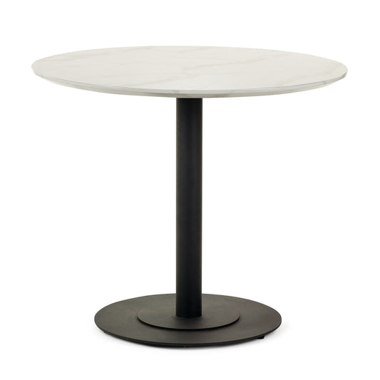 Round table with white top and black base on a white background