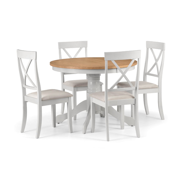 Dining table set with four chairs on a white background