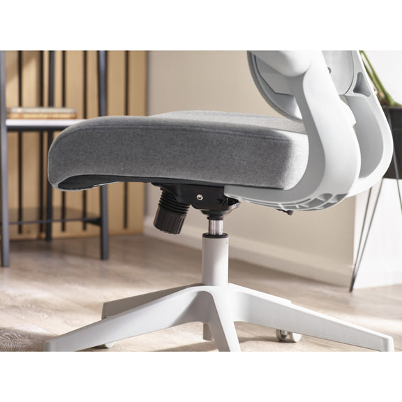 Close-up of a white office chair with gray cushioned seat in an indoor setting.