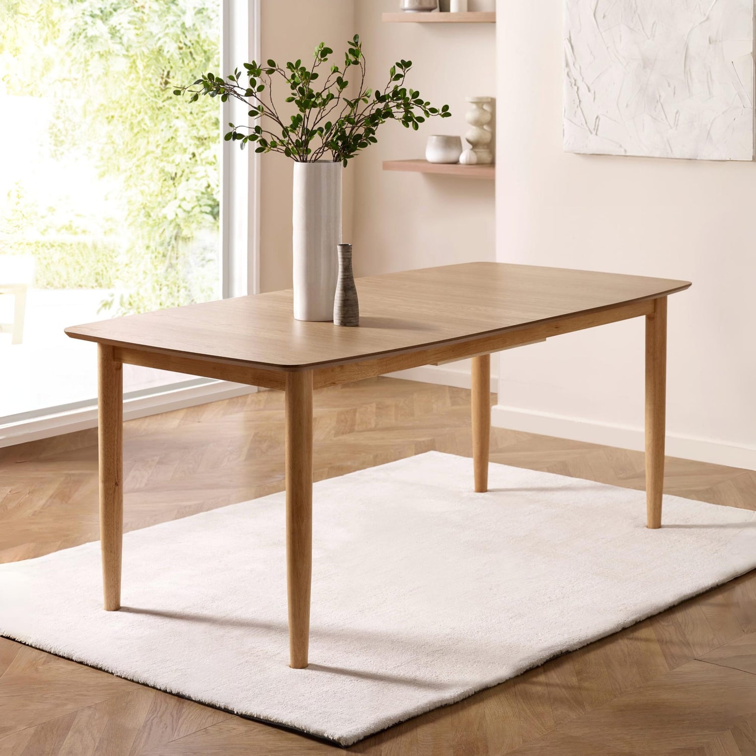 Wooden dining table in a bright room with natural light