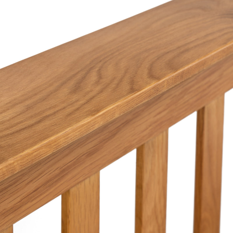 Close-up of a wooden bench with a white background