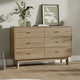 Wooden dresser with decorative items on a wooden floor