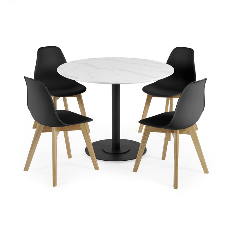 Round white table with four black chairs on a white background