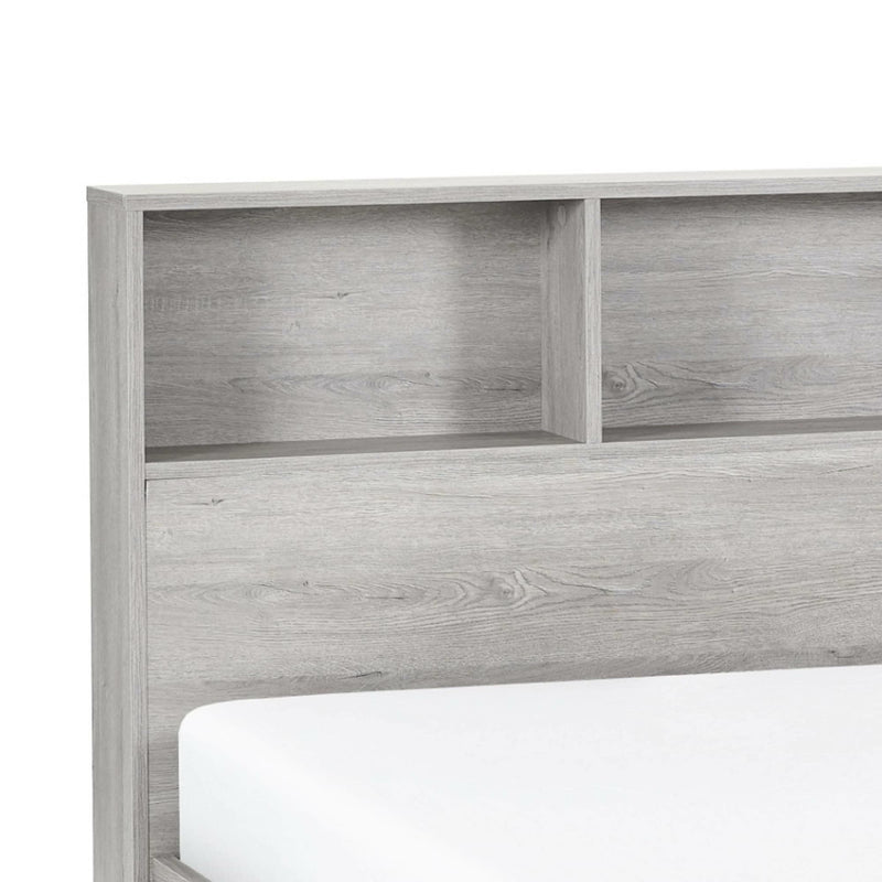 Wooden headboard with bookshelf design on a white background