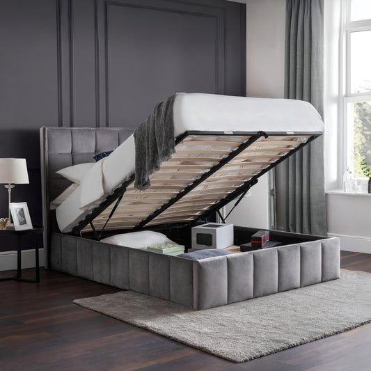 Gray upholstered bed with storage compartment in a bedroom setting