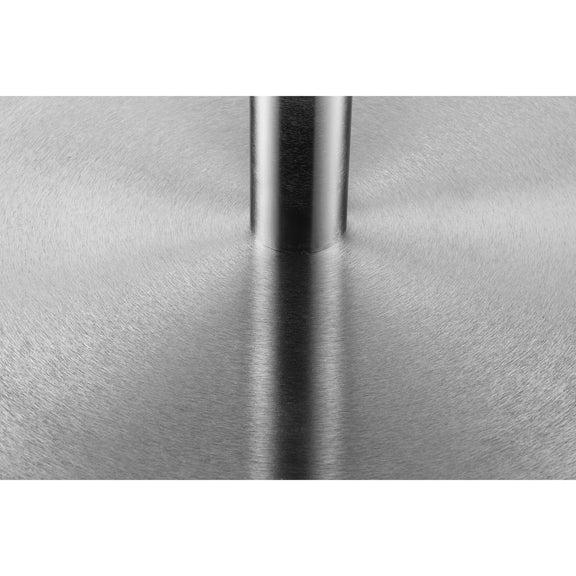 Close-up of a metallic surface with a reflective strip