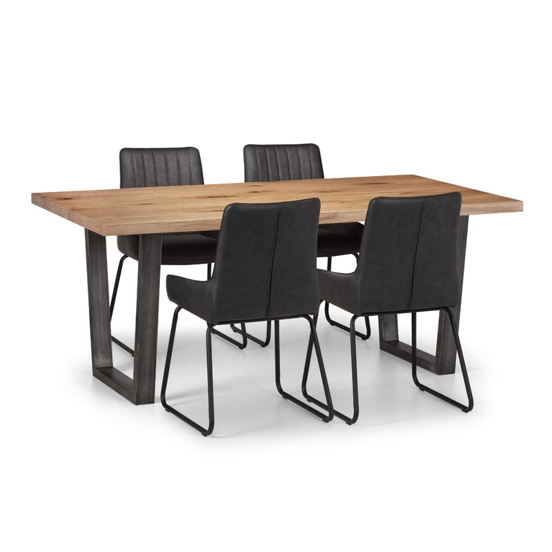 Dining table with four black chairs on a white background