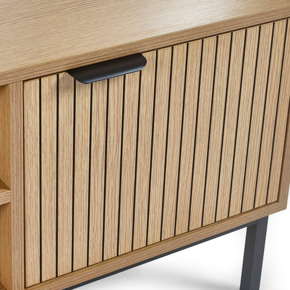Wooden cabinet with slatted design and black handle on a white background