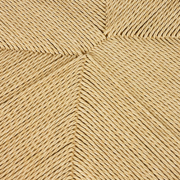 Close-up of a woven pattern with interlocking lines in a beige color.
