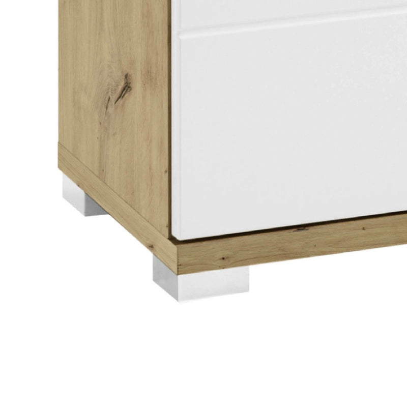 Corner of a wooden cabinet with white panel on a white background