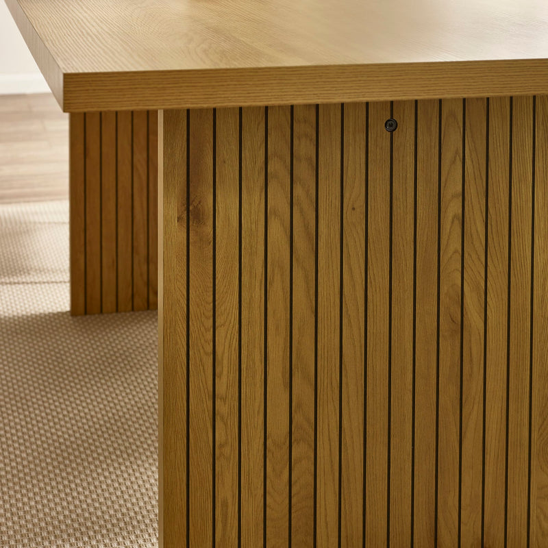 Close-up of a wooden deck with horizontal slats and a textured floor.