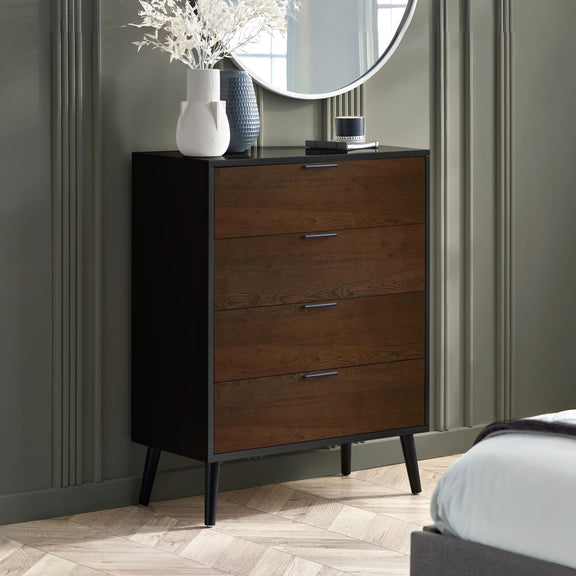 Wooden dresser with three drawers in a bedroom setting.