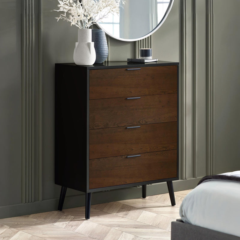 Wooden dresser with three drawers in a bedroom setting.