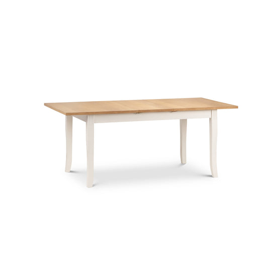 Wooden table with white legs on a white background