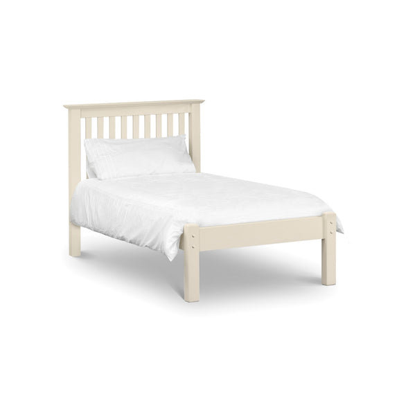 White wooden bed with white bedding on a white background