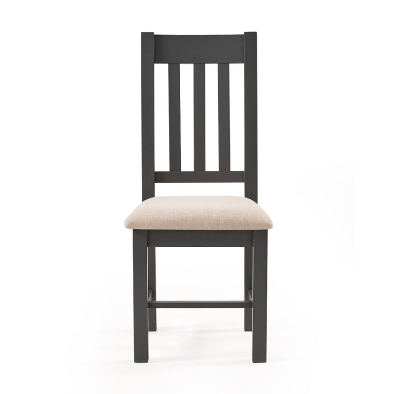 Black wooden chair with a beige cushion on a white background