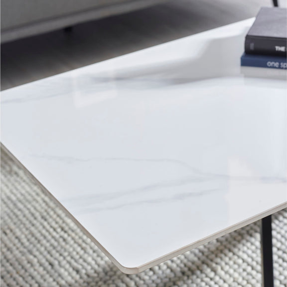 White rectangular object on a textured surface with a blurred background
