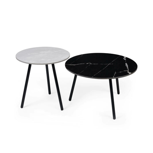 Two round marble coffee tables, one black and one gray, on a white background.