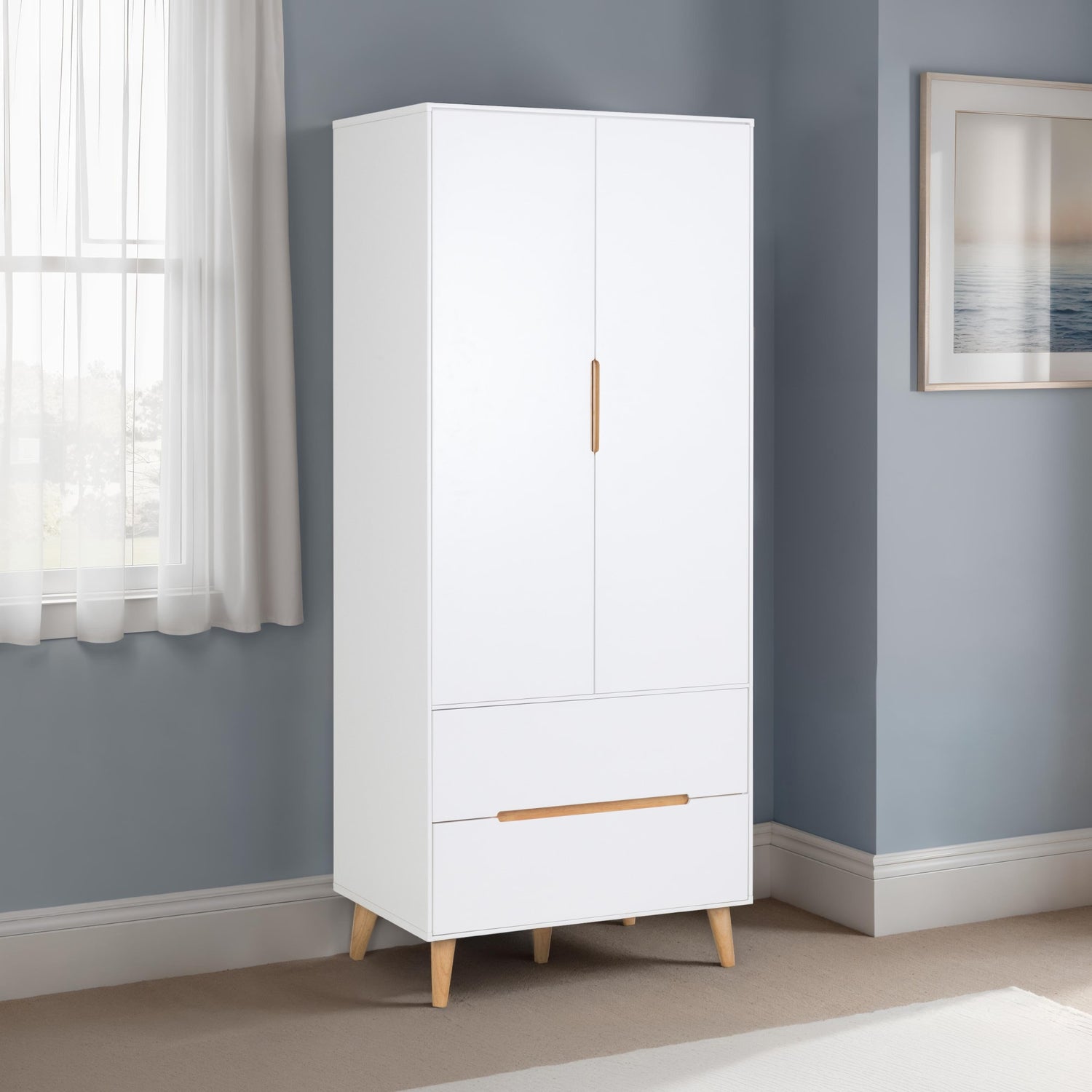 White wardrobe with wooden legs in a room with a window and framed picture on the wall.