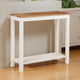Small wooden table with white base in a room setting