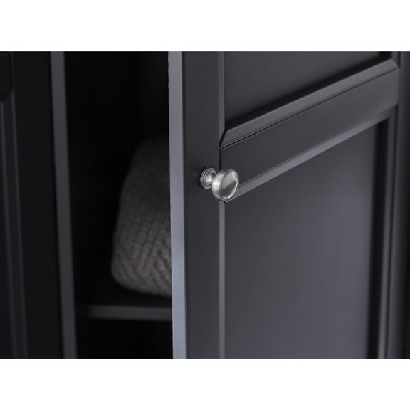 Close-up of a black cabinet with a silver knob on a white background