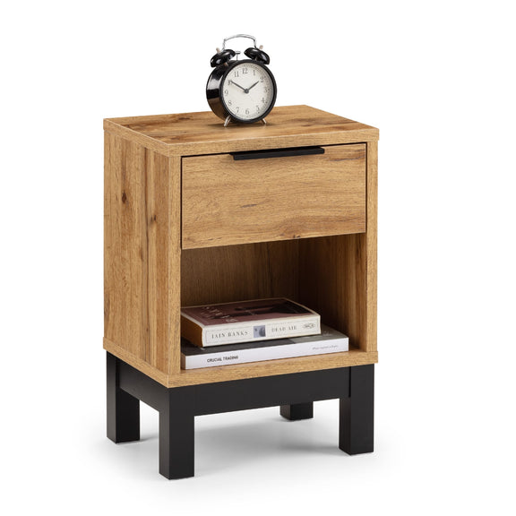 Wooden nightstand with a clock and books on a white background