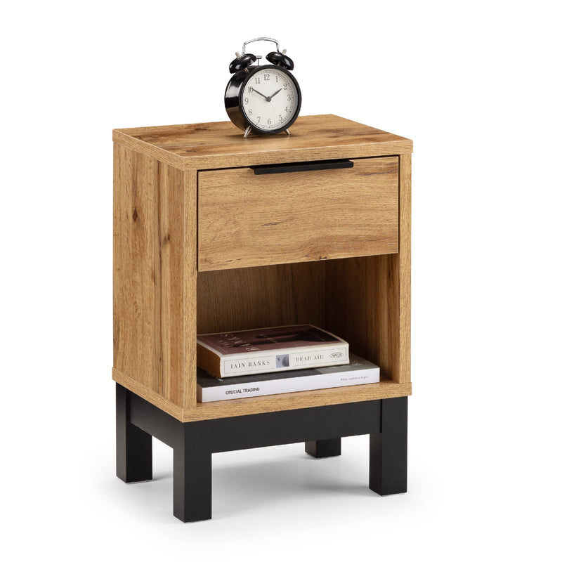 Wooden nightstand with a clock and books on a white background