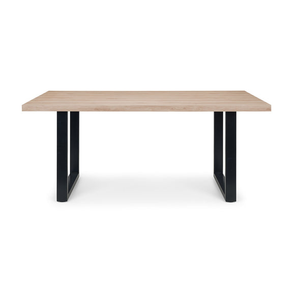 Table with wooden top and black metal legs on a white background