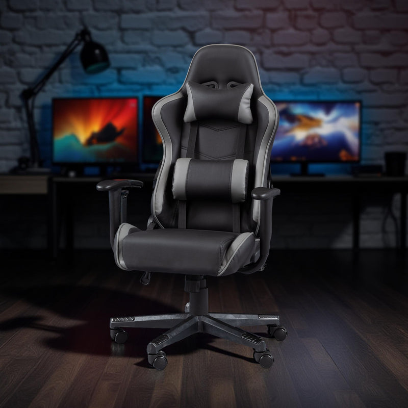 Gaming chair in a room with multiple monitors on a desk.
