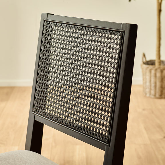 Chair with woven backrest on a wooden floor