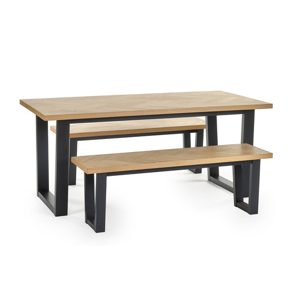Wooden dining table with matching benches on a white background