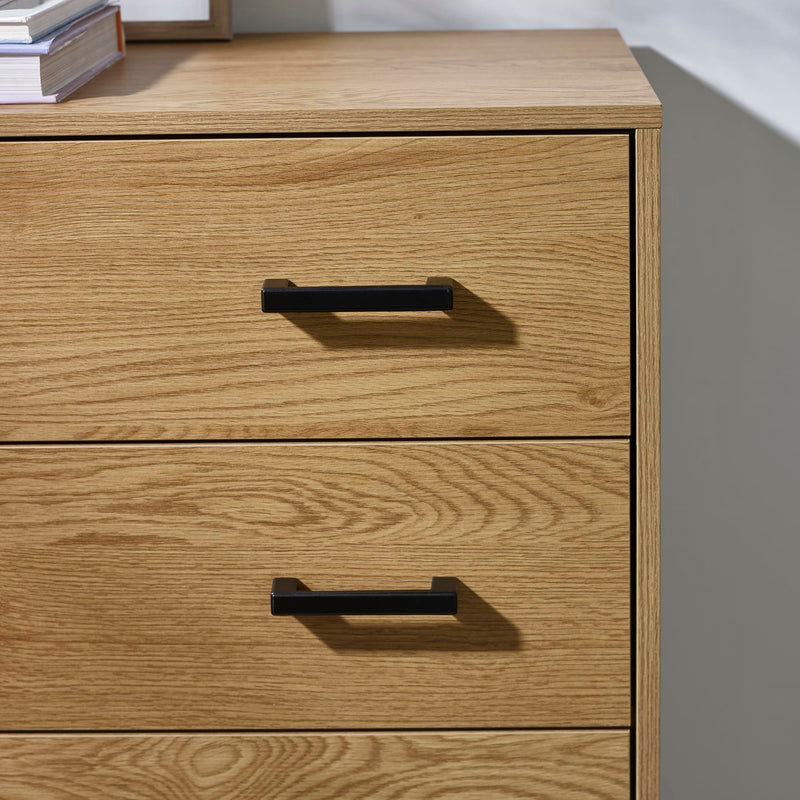 Wooden dresser with two drawers and black handles on a neutral background