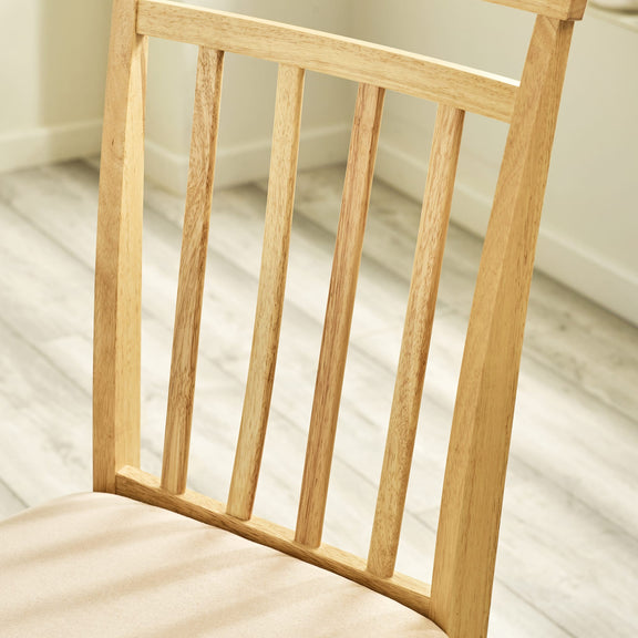 Wooden chair with a cushion on a light wooden floor