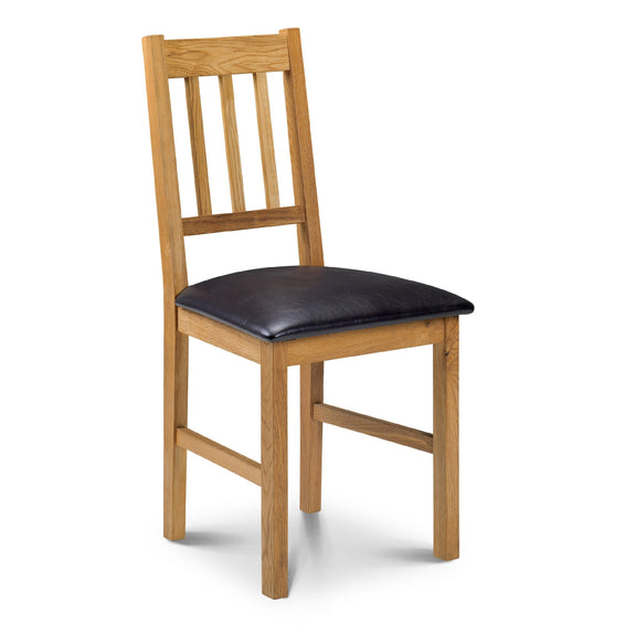 Wooden chair with a black cushion on a white background