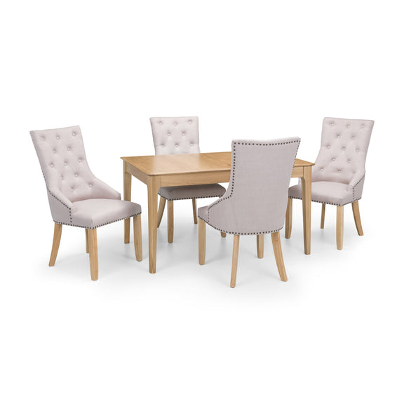 Dining table set with four upholstered chairs on a white background