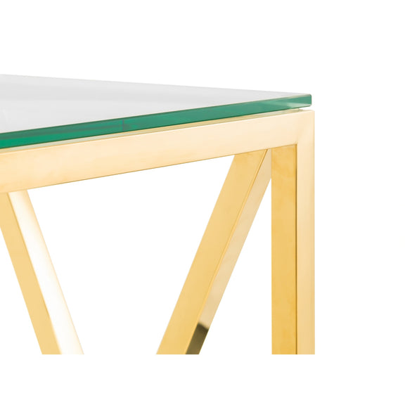 Glass table with gold legs on a white background