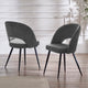 Two gray chairs with black legs on a wooden floor.
