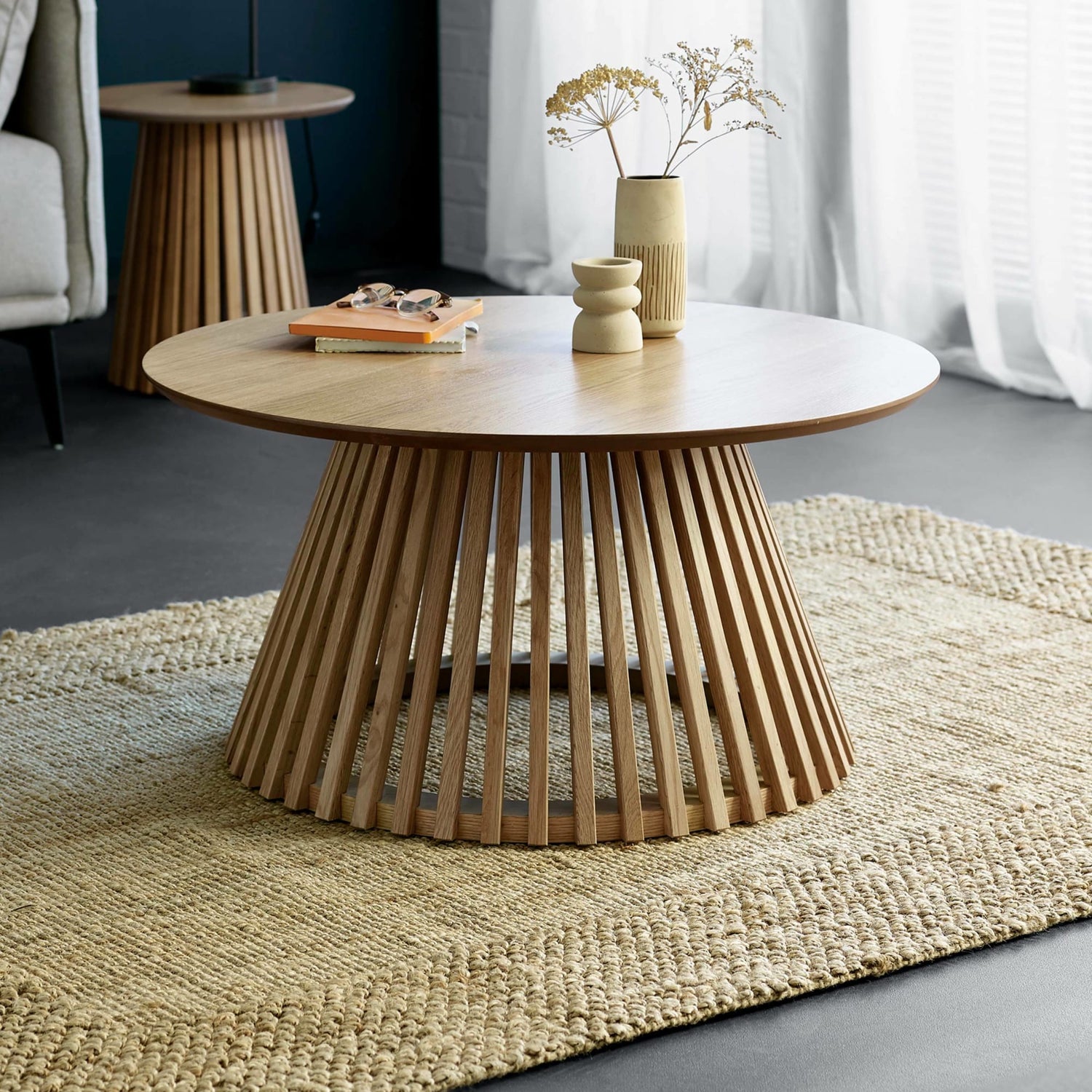Wooden coffee table with a textured base in a living room setting