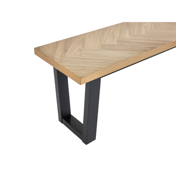 Wooden table with a chevron pattern on a white background