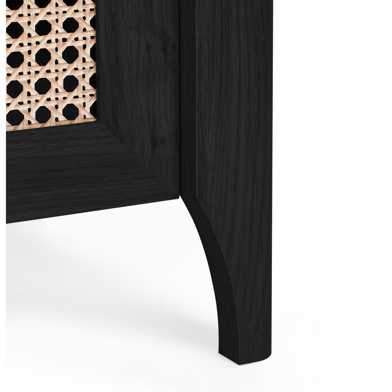 Corner of a black wooden cabinet with wicker basket